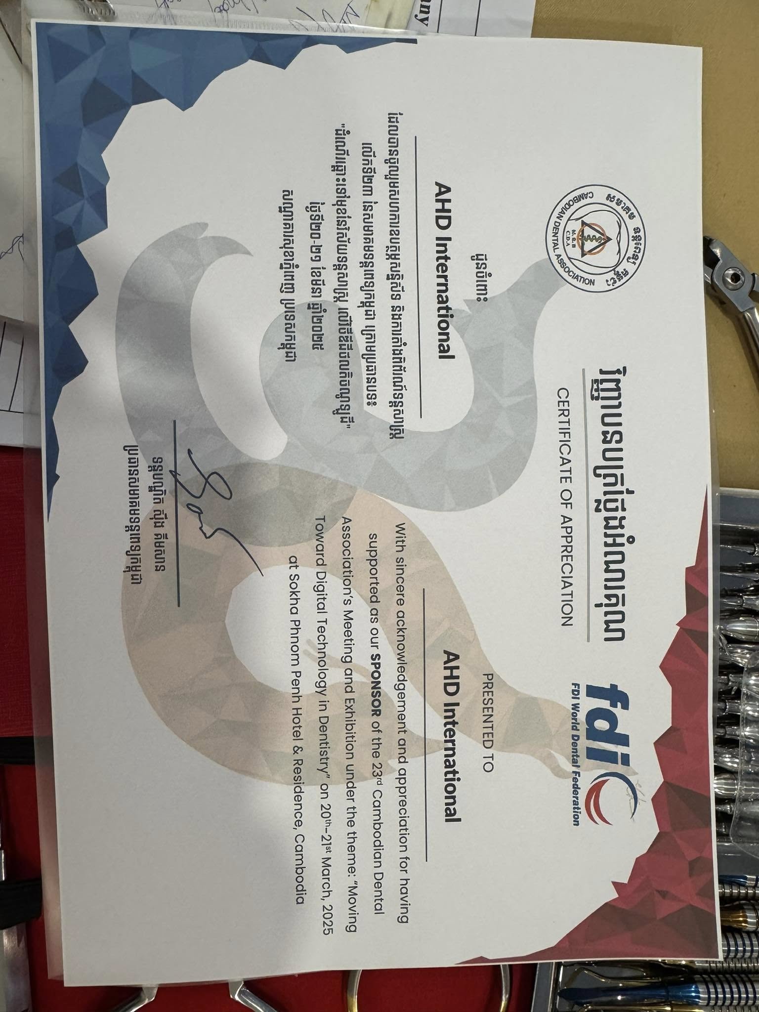 Detailed view of dental tools and equipment on AHD display table